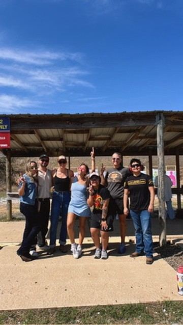 Group photo at the range for Girls, Gays & Guns